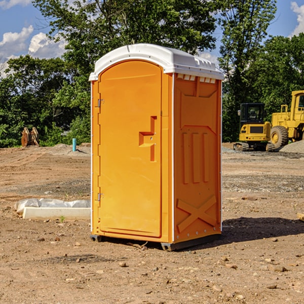 what is the cost difference between standard and deluxe portable restroom rentals in Brookside